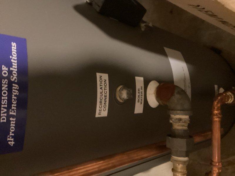 Responded to service call for boiler leak and system concerns. Upon inspection, identified multiple components requiring replacement and confirmed leak at boiler unit. Evaluated infloor heating tank which was not heating properly and discussed system update options with homeowner. Installed new smart thermostat for heating and cooling zone, successfully programmed unit and connected to mobile application. Assessed recirculation system and documented need for additional recirculating pump on domestic hot water side. Photographed existing equipment configuration including boiler, expansion tank, copper piping connections, and recirculation components for future reference and system upgrade planning.