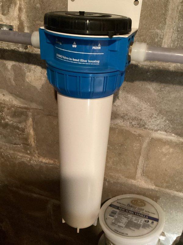 Responded to service call for beeping water treatment system with A3 alarm code indicating UV lamp replacement needed. Inspected complete water filtration system including mineral filter tank and water softener with dual black tanks. Diagnosed electronic controller alarm, replaced UV lamp assembly, and performed comprehensive filter inspection and replacement on all filtration units to ensure optimal system performance in single visit.