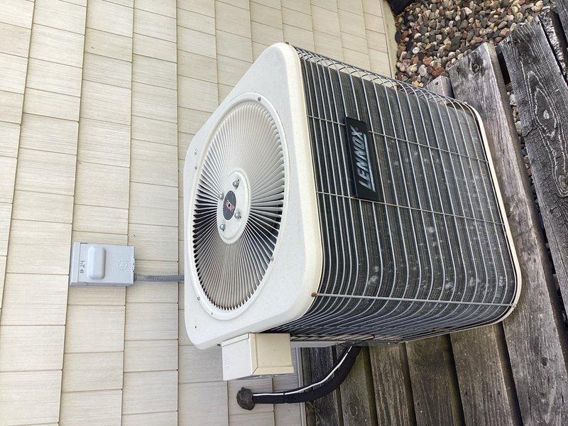 Performed comprehensive cooling system tune-up on 23-year-old Bryant air conditioning unit, inspecting both indoor air handler and outdoor condenser components. System is operating with an 18-degree temperature split and refrigerant charge appears borderline low but functional under current conditions; noted that mild ambient temperature (67°F) limited full load testing capabilities. Customer advised of unit's age and plans to continue operation until replacement becomes necessary.