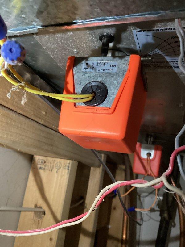 Replaced malfunctioning zone damper actuator motor that was sticking and preventing proper zone control operation. Removed old actuator, installed new replacement unit, verified proper damper movement and electrical connections, and performed complete system tune-up to ensure optimal performance.