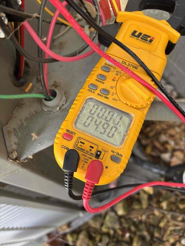 Completed annual air conditioning tune-up and maintenance on one Lennox outdoor condensing unit. Performed comprehensive system inspection including filter check, thermostat operation verification, temperature differential measurement, condenser coil inspection, motor operation assessment, capacitor testing with digital multimeter, compressor functionality check, refrigerant charge evaluation, and condensate drain verification. Outside ambient temperature recorded at 69 degrees. All components tested within normal operating parameters with no deficiencies noted. System operating properly at time of service completion.