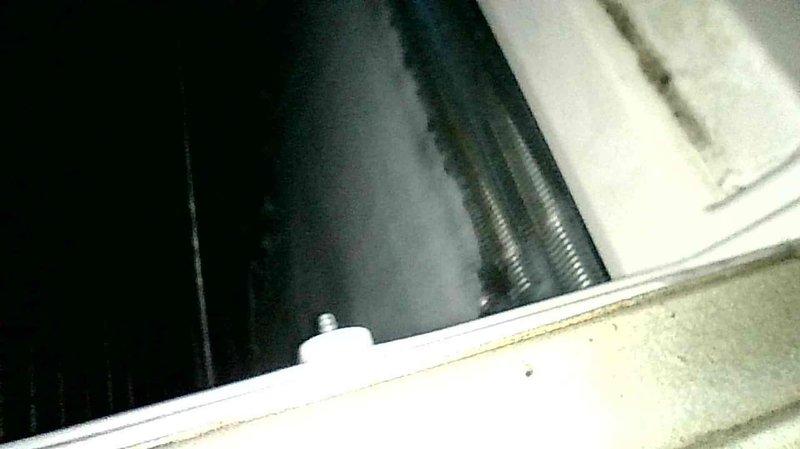 Responded to no cooling complaint on 5-year-old system. Upon arrival, observed suction line freezing at outdoor unit. Inspection revealed failed blower motor capacitor reading zero microfarads. Replaced capacitor and conducted operational testing with refrigerant gauges, which indicated low suction pressure due to frozen evaporator coil. Advised system shutdown to allow coil to thaw completely before resuming operation. System operational after capacitor replacement pending coil thaw.
