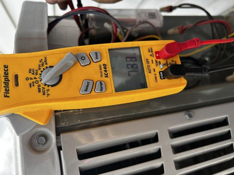 Responded to no cooling complaint on 5-year-old system. Upon arrival, observed suction line freezing at outdoor unit. Inspection revealed failed blower motor capacitor reading zero microfarads. Replaced capacitor and conducted operational testing with refrigerant gauges, which indicated low suction pressure due to frozen evaporator coil. Advised system shutdown to allow coil to thaw completely before resuming operation. System operational after capacitor replacement pending coil thaw.