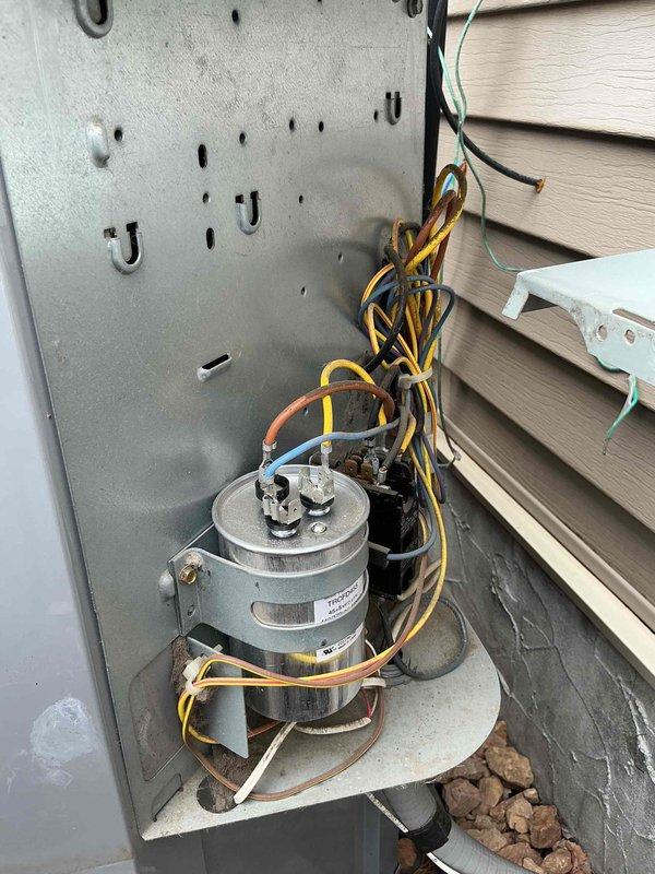 Completed annual cooling preventive maintenance visit on 11-year-old residential air conditioning system. Performed comprehensive AC inspection per maintenance agreement protocol. During inspection, discovered cracked collector box on outdoor condensing unit. Removed damaged collector box and installed replacement component. Verified all electrical connections secure, inspected compressor motor operation, and confirmed system functionality upon completion of repair.