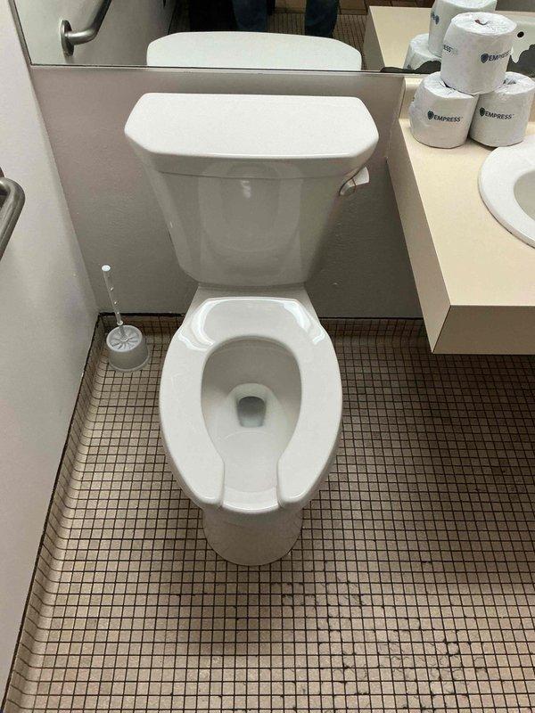 Responded to no-flush condition in women's restroom at commercial facility. Upon inspection, determined existing toilet was 25 years old and beyond economical repair. Removed and disposed of failed unit. Installed new ADA-compliant comfort height toilet with elongated bowl, open front seat, and right-hand trip lever configuration suitable for commercial application. Tested flush mechanism and verified proper operation. Restroom returned to full service.