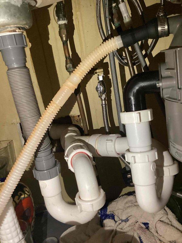 Installed a dedicated water shut-off valve for dishwasher connection to existing under-sink plumbing infrastructure. The valve was successfully integrated into the current supply line configuration, providing independent water control for the dishwasher appliance. All connections were secured and tested for proper operation.