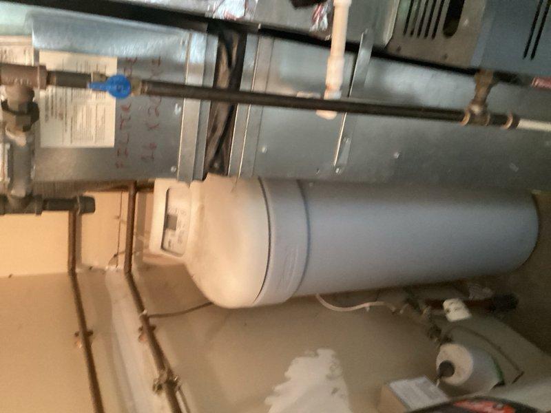 Responded to pinhole leak in copper piping connected to water heater. Upon inspection, identified failed solder joint in copper line located above the water heater unit. Removed defective section of copper pipe and replaced with new copper piping, creating proper solder joints to ensure watertight seal. Tested system for leaks and verified repair integrity before completion.