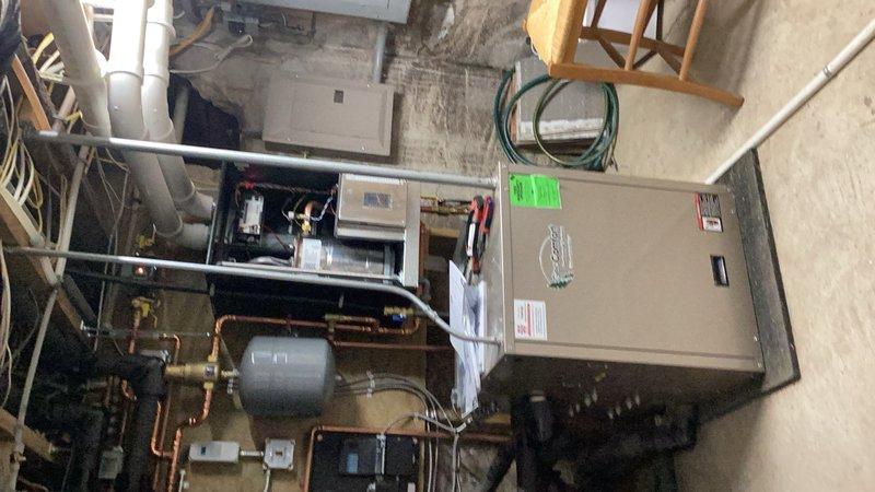 Responded to complaint of excessively hot domestic water temperature. Found domestic hot water at 170° with boiler cycling continuously. Boiler heating parameter was incorrectly configured, causing system to run nonstop and overheat domestic water supply. Drained water heater to reduce temperature to 110° at tap, then adjusted boiler parameters to proper settings. Configured domestic hot water to heat to 130° and set heating parameter reset for air handler operation at 140°. Tested both domestic hot water delivery and hydronic heating system to verify proper operation. System now functioning correctly with appropriate temperature control for both domestic water and space heating.