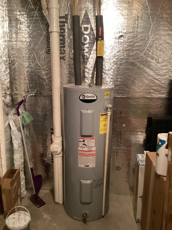 Responded to customer request to evaluate water heater experiencing inadequate hot water supply. Upon inspection, determined the 11-year-old A.O. Smith water heater had reached the end of its serviceable life and was no longer providing sufficient hot water capacity for household needs. Removed and disposed of existing unit. Installed new A.O. Smith residential water heater in utility room location. Connected all water supply lines with proper pipe insulation applied to hot and cold water connections. Verified proper venting and exhaust configuration with PVC and metal ductwork. Tested unit operation, confirmed proper heating function, and ensured no leaks at connection points. System restored to full operational capacity with adequate hot water supply.