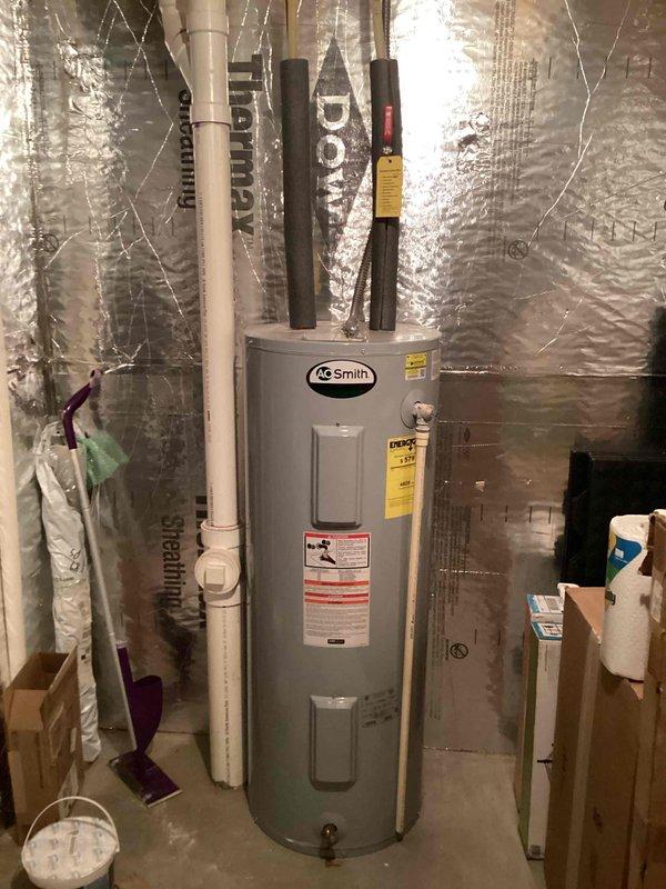 Responded to customer request to evaluate water heater experiencing inadequate hot water supply. Upon inspection, determined the 11-year-old A.O. Smith water heater had reached the end of its serviceable life and was no longer providing sufficient hot water capacity for household needs. Removed and disposed of existing unit. Installed new A.O. Smith residential water heater in utility room location. Connected all water supply lines with proper pipe insulation applied to hot and cold water connections. Verified proper venting and exhaust configuration with PVC and metal ductwork. Tested unit operation, confirmed proper heating function, and ensured no leaks at connection points. System restored to full operational capacity with adequate hot water supply.