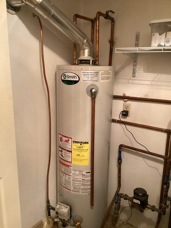 Completed comprehensive plumbing inspection with focus on water heater evaluation. Inspected A.O. Smith water heater unit, including copper piping connections, pressure regulator, and valve assembly. No immediate issues identified during inspection, however water heater shows age and replacement is recommended for optimal performance and reliability.