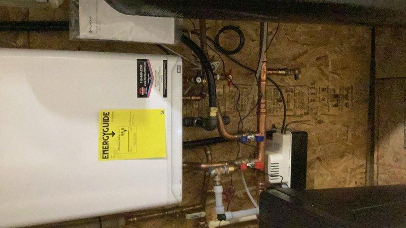Completed comprehensive plumbing inspection for friends and family program. Inspected and verified proper operation of tankless water heater system with all copper supply lines, shut-off valves, and gas connections in good working condition. Examined water softener system and confirmed proper function. All under-sink plumbing including P-trap assemblies and supply lines inspected and found to be well-maintained with no leaks or deficiencies noted.