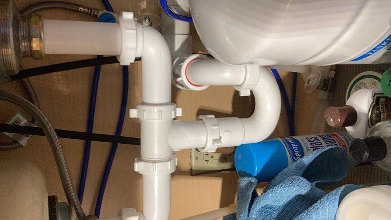 Completed comprehensive plumbing inspection for friends and family program. Inspected and verified proper operation of tankless water heater system with all copper supply lines, shut-off valves, and gas connections in good working condition. Examined water softener system and confirmed proper function. All under-sink plumbing including P-trap assemblies and supply lines inspected and found to be well-maintained with no leaks or deficiencies noted.