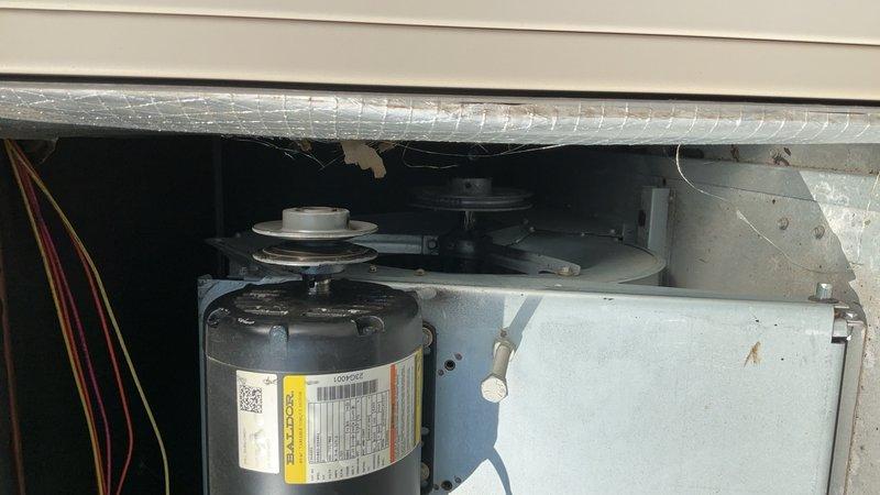 Responded to service call for RTU #1 not maintaining setpoint temperature of 67°F, with space temperature rising to 73°F. Upon inspection, discovered broken fan belt on blower motor assembly. Replaced failed belt with new belt, restoring proper airflow and system operation to manufacturer specifications.