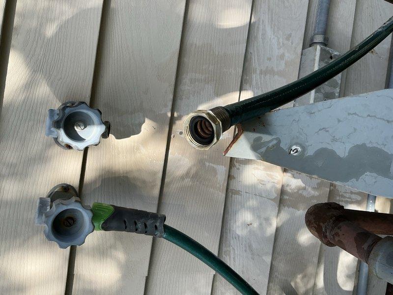 Responded to two leaking outdoor faucets at rear of property. The right-side spigot exhibited a pencil-stream leak and required complete stem rebuild with replacement of all internal components. The left-side faucet showed severe leaking from the aerator, compounded by a garden hose being left connected through winter, causing freeze damage; replaced the aerator assembly. Customer opted for repair over full replacement to avoid interior wall access near occupied living space. Advised ongoing monitoring of both fixtures due to age and condition of existing hardware.