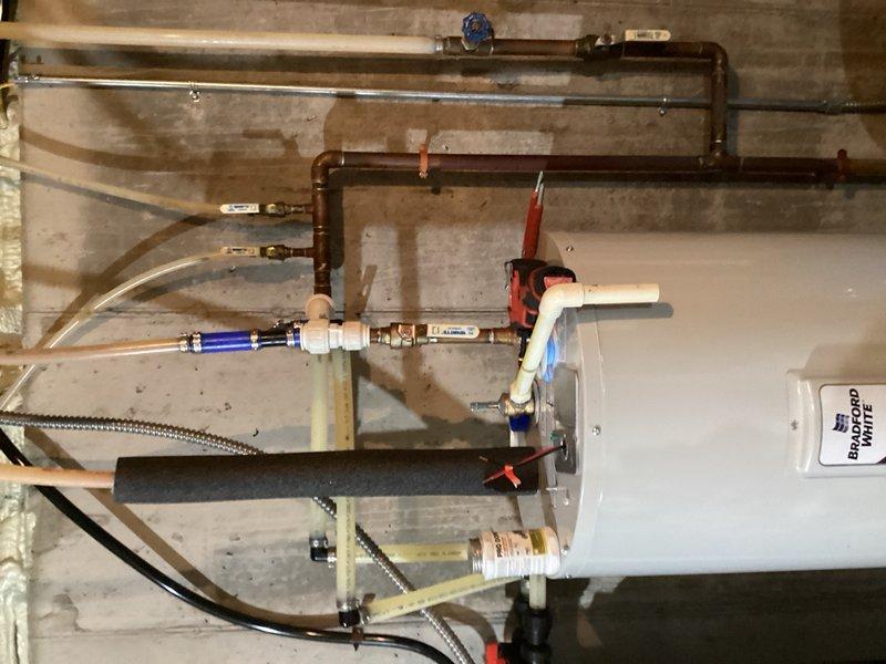 Responded to a leaking electric water heater in a 3,000 square foot residential property. Upon arrival, confirmed active water leak from the existing 50-gallon electric water heater with visible water accumulation on the floor. Removed and disposed of the failed unit, then installed a new 50-gallon electric water heater with proper connections to existing copper supply lines, drain lines, and electrical service. Verified all plumbing connections for leaks, tested temperature and pressure relief valve operation, and confirmed proper electrical function and heating capability of the new unit.