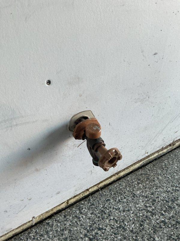 Responded to service call for leaking outdoor spigot. Upon arrival, found existing frost-proof spigot heavily corroded and failed, with visible water damage at wall penetration point. Removed deteriorated fixture and installed new Woodford brand frost-proof outdoor spigot, ensuring proper pitch for drainage and secure connection to existing copper supply line. Tested operation and verified leak-free installation.