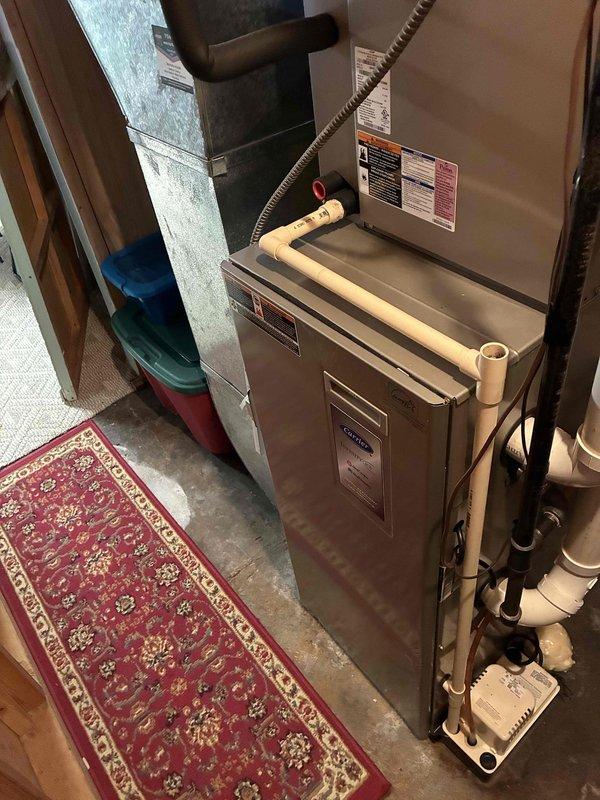 Completed comprehensive preventive maintenance on both air conditioning system and boiler. The 14-year-old Carrier AC unit received full inspection including condenser coil cleaning, electrical testing with all readings within manufacturer specifications, air filter verification, condensate drain clearing, and refrigerant charge confirmation with proper temperature differential of 22-23 degrees. The recently installed boiler and water heater underwent routine maintenance including cleaning of standard components, condensate trap servicing, and ignition rod cleaning. Both systems were operationally tested and confirmed functioning properly with no issues identified.