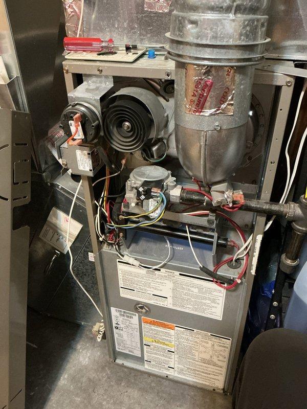 Completed annual cooling maintenance visit on 21-year-old AC system. During inspection, identified multiple components showing wear and deterioration: contactor exhibiting signs of failure, elevated subcool readings indicating system restriction likely caused by clogged TXV, control board displaying burn marks around resistors, and blower motor actively leaking oil. System remains operational at this time, though multiple components are approaching end of service life and will require attention in the near future to maintain reliable operation.