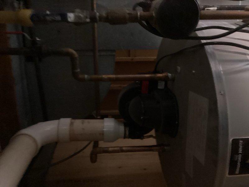 Responded to service call for reported toilet leak in downstairs bathroom. Upon arrival, inspected toilet installation and surrounding floor area. Found yellow water stain adjacent to toilet base, but area was completely dry at time of inspection. 

Accessed basement utility area directly below bathroom to examine plumbing connections and cast iron toilet flange. Inspected flange mounting, wax ring seal integrity, and all visible drain connections from below. Found no evidence of active water leakage, moisture, or water damage on flange, drain pipes, or surrounding structural components. All plumbing connections appeared secure and properly sealed.

Based on inspection findings, determined yellow staining likely resulted from previous minor seepage that has since resolved, or may be surface staining unrelated to plumbing failure. Advised monitoring the area for any recurrence of moisture or staining. Recommended immediate callback if wet conditions develop, as this would indicate compr