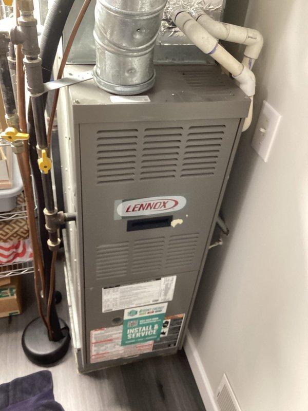 Completed annual cooling maintenance visit and preventative maintenance tune-up on older Lennox furnace and air conditioning system. Performed comprehensive spring inspection of HVAC equipment, verified thermostat operation showing 70° with system in off mode and fan set to auto, and inspected all accessible components including ductwork, PVC condensate lines, and refrigerant piping. No deficiencies identified and no repairs required at this time.