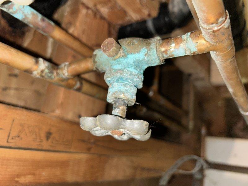 Responded to service call for leaking hose bibs and loose water shut-off valve. Upon inspection, identified loose packing nuts on all three exterior hose bibs causing water seepage. Tightened packing nuts on each hose bib to proper torque specification, eliminating leaks. Inspected water shut-off valve showing signs of corrosion and verdigris buildup on brass components, confirmed proper operation after addressing packing nut issues. All fixtures tested and verified leak-free upon completion.