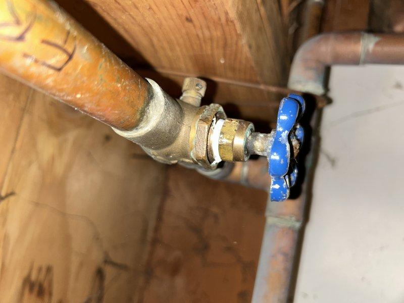 Responded to service call for leaking hose bibs and loose water shut-off valve. Upon inspection, identified loose packing nuts on all three exterior hose bibs causing water seepage. Tightened packing nuts on each hose bib to proper torque specification, eliminating leaks. Inspected water shut-off valve showing signs of corrosion and verdigris buildup on brass components, confirmed proper operation after addressing packing nut issues. All fixtures tested and verified leak-free upon completion.