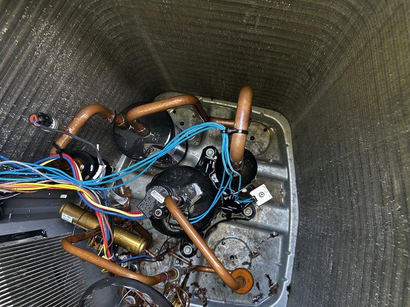 Completed comprehensive heat pump tune-up and testing in cooling mode. Verified proper airflow settings, cleared condensate drain line, and installed new air filter with excellent temperature differential of 20° achieved at basement level. Removed rodent nest from outdoor unit, performed condenser coil cleaning, and adjusted defrost board termination setting from 50° to 100° for optimal performance. Recommended UV bulb replacement due to age (approximately three years old). All systems tested and operating within normal parameters.