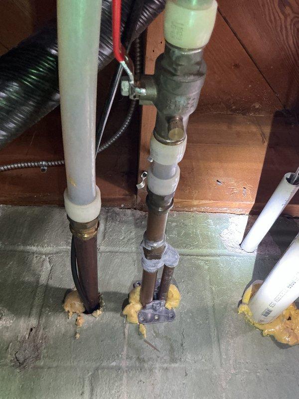 Responded to service call for malfunctioning exterior hose bibb at commercial property. Upon inspection, determined the existing commercial-grade hose bibb was beyond repair and required full replacement. Assessed the installation location and underlying plumbing infrastructure, including the supply lines running through the basement utility area. Documented the current condition with photographs showing the pipe configuration, insulation, and connection points where the supply line penetrates the concrete floor and extends to the exterior fixture. Prepared a comprehensive replacement estimate for the property manager's review, detailing the scope of work required to install a new commercial-grade hose bibb assembly with proper shutoff valve and freeze protection measures.