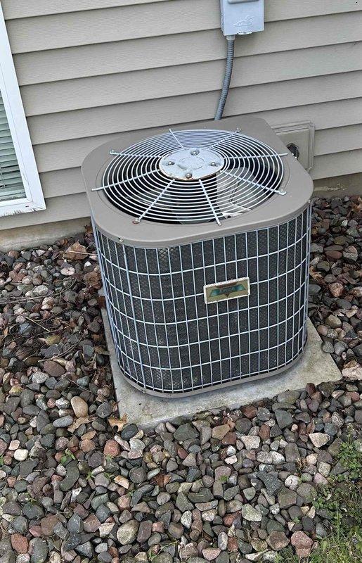 # HVAC Maintenance Agreement Completed

Performed comprehensive 12-point air conditioning tune-up on residential split system with Guardian furnace and outdoor condenser unit. Cleaned outdoor condenser equipment and coils, tested all electrical components for proper operation, and cleaned indoor evaporator drain line to ensure proper condensate removal. System evaluated and found to be cooling adequately, though operating near freezing threshold which will require monitoring. Captured detailed photographs of equipment including make, model, and serial number information for service records. Unit age uncertain; system appears to be functioning within acceptable parameters despite borderline temperature readings on evaporator coil.