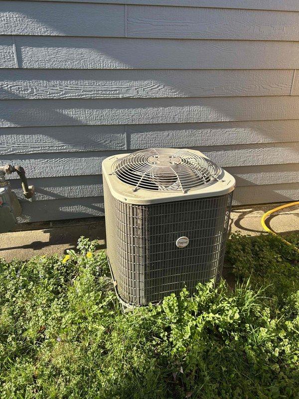 Completed comprehensive furnace and air conditioning tune-up as part of maintenance agreement. During AC inspection, identified deficient capacitor on fan side with low microfarad reading; all other outdoor unit components tested within normal parameters. Replaced failed capacitor to restore proper system operation. Customer approved blower motor replacement to be completed during upcoming heating season visit; part order form submitted. System functioning properly with zero thermal load at time of service.