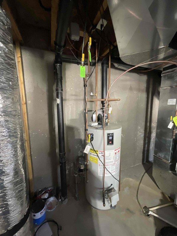 Conducted on-site assessment to provide estimate for water meter hookup replacement in mechanical utility room. Inspected existing plumbing configuration including water heater connections, copper supply lines, and main water service entry point to determine scope of work required for meter hookup replacement.