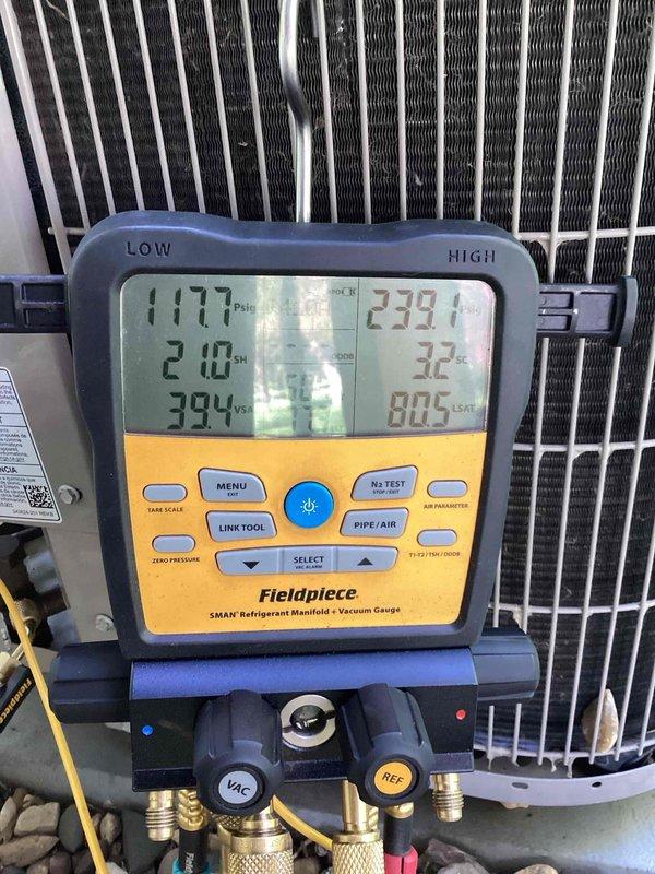 Completed annual cooling system tune-up as part of recurring maintenance agreement. Performed comprehensive system inspection, replaced air filter, and verified all components operating within normal parameters. Exterior condensing unit showed significant debris accumulation around electrical components and coils; cleaned affected areas to ensure proper airflow and prevent potential performance issues. Recorded system pressures and temperatures using refrigerant manifold gauges, confirming optimal refrigerant charge levels and system performance. All electrical connections, capacitor, contactor, and motor assembly inspected and found functional despite visible weathering on exterior components.