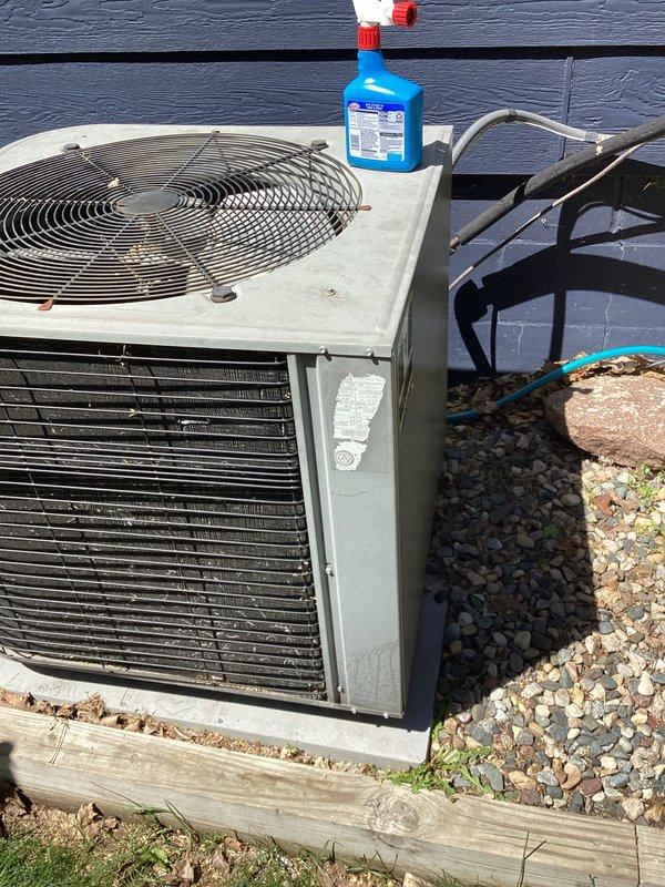 Completed seasonal AC tune-up and identified capacitor showing signs of failure along with refrigerant pressure reading slightly below optimal range. Documented equipment condition with photos and advised that a comfort advisor will follow up to provide replacement pricing options.