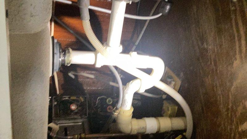 Completed annual plumbing inspection including comprehensive examination of water softener system, sump pump assembly with PVC drainage configuration, and associated mechanical equipment in utility area. All plumbing components, connections, and fixtures were visually inspected and found to be functioning properly with no immediate concerns identified.