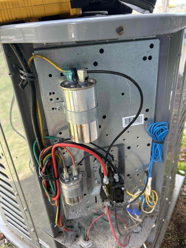 Performed comprehensive AC system evaluation including inspection of Ritz coil and all major components. Filter, blower assembly, and evaporator coil were found clean and in good condition. Homeowner reported inadequate cooling performance from previous season. Conducted operational test which revealed suboptimal 12-degree temperature split across the evaporator. Connected refrigerant manifold gauges and confirmed system pressures appear low, even with condenser unit covered during testing. Inspected electrical components including dual capacitors and associated wiring, all connections secure and functioning properly. Recommended follow-up appointment to verify refrigerant charge and system pressures once ambient temperature reaches minimum 60 degrees for accurate diagnostics.