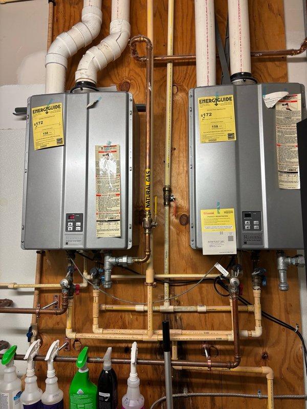 Responded to service call for low hot water issues in women's locker room affecting dual tankless water heater system. Upon arrival, found both units short cycling with Error Code 10 indicating air flow restriction. Performed diagnostic inspection of intake vents on both heaters and confirmed no visible blockages present. Exhausts were inaccessible due to sealed installation and lack of roof access for verification. Consulted with manufacturer technical support who advised that internal dust and debris accumulation on fan assembly, heat exchanger, or burner components was likely causing air restriction and system errors. Technical support recommended either replacing affected components (fan, heat exchanger, and/or burner) or full unit replacement to resolve the issue. Also investigated possibility of bad check valves or mixing valve cartridges in utility sink or shower fixtures that could be causing cold water crossover into hot water lines, which would contribute to perceived water h
