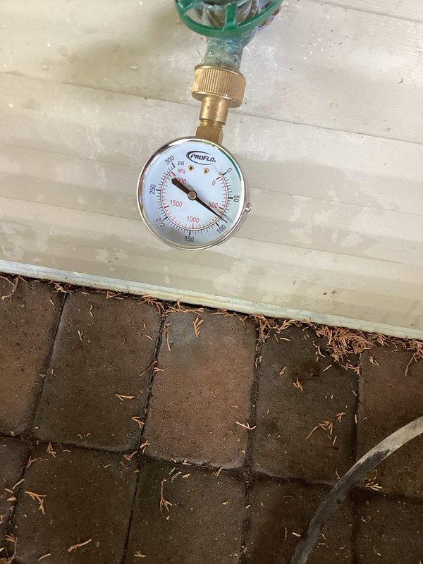 Responded to service call regarding outdoor faucet that had frozen the previous fall with concerns about potential pipe damage and leaks behind refrigerator. Conducted thorough inspection of the outdoor faucet connection and associated plumbing using pressure gauge to test system integrity. Verified water pressure readings and examined all accessible piping and connections in the area. Inspection confirmed no leaks present in the system, no burst pipes detected, and all plumbing components functioning properly. Customer advised that outdoor faucet and water supply line are intact and safe to resume normal operation.