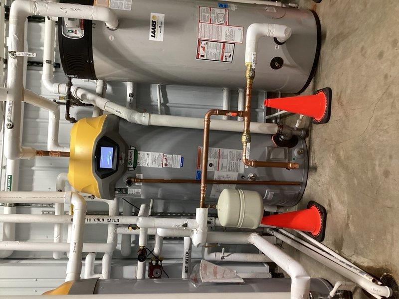 Responded to commercial facility for failed water heater with active leak. Removed existing defective unit and installed new 100-gallon commercial-grade tanked water heater. Completed all copper piping connections with proper soldering techniques, installed brass ball valves for system isolation, and integrated PVC venting per manufacturer specifications. Connected hot and cold water supply lines, installed expansion tank, and verified all connections for leaks. Mounted temperature and pressure relief valve with appropriate discharge piping. System tested, pressurized, and confirmed operational with no leaks detected.