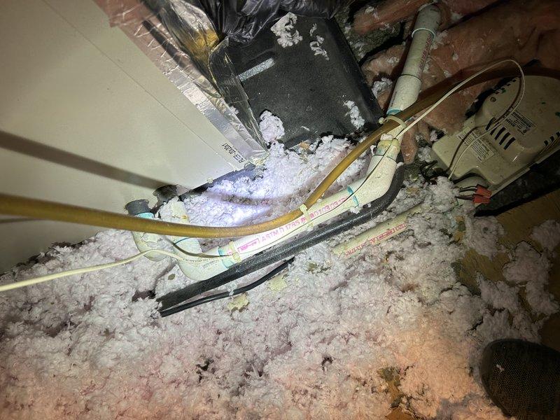 Completed preventative maintenance tune-up on 15-20 year old air conditioning system located in attic space accessible through interior closet. During inspection, identified defective capacitor with low readings and replaced with new unit to restore proper system operation. Observed significant condensation accumulation and frost buildup on exposed ductwork and insulation, indicating potential insulation deficiency or airflow issues requiring further assessment. Coordinated follow-up sales consultation to provide estimate for ductwork remediation and insulation improvements.