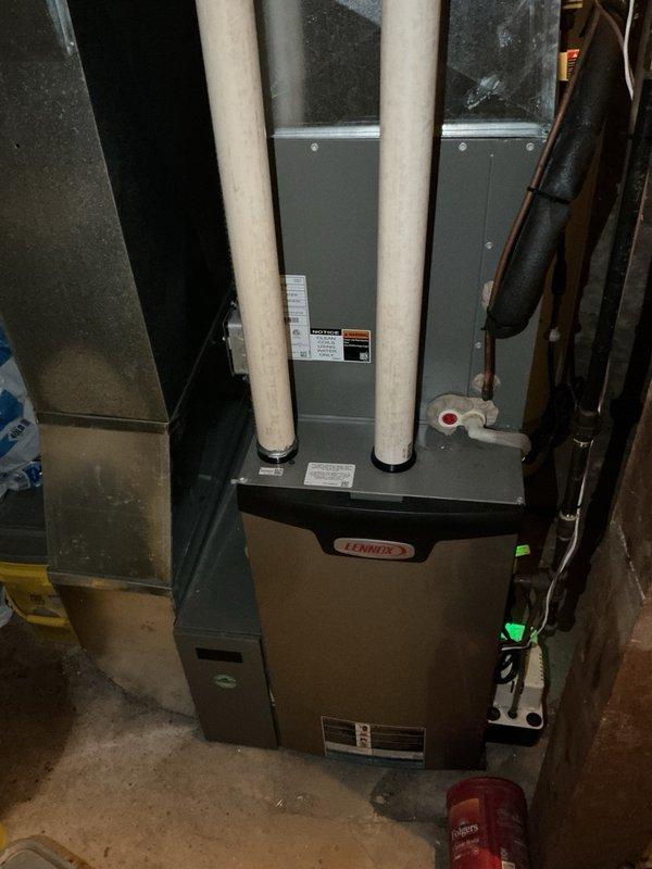 Performed comprehensive furnace and air conditioning tune-up on residential HVAC system. Inspected furnace components including flame sensor cleaning, verified condensate drainage functionality, checked gas pressure and electrical components—all readings within manufacturer specifications. System startup confirmed proper operation with 50° temperature rise.

Conducted AC maintenance including evaporator drain flush and air filter inspection. Accessed outdoor condenser unit, removed panels, and performed thorough coil cleaning due to heavy dirt accumulation. Flushed coil completely and reassembled unit. System tested successfully with 20° temperature drop across evaporator coil.

Diagnosed mini split system experiencing line freeze-up at outdoor unit. Connected manifold gauges and identified critically low refrigerant charge with minimal system pressure. Prepared estimates for refrigerant recharge with UV dye injection for leak detection. Central HVAC system confirmed operational and pe