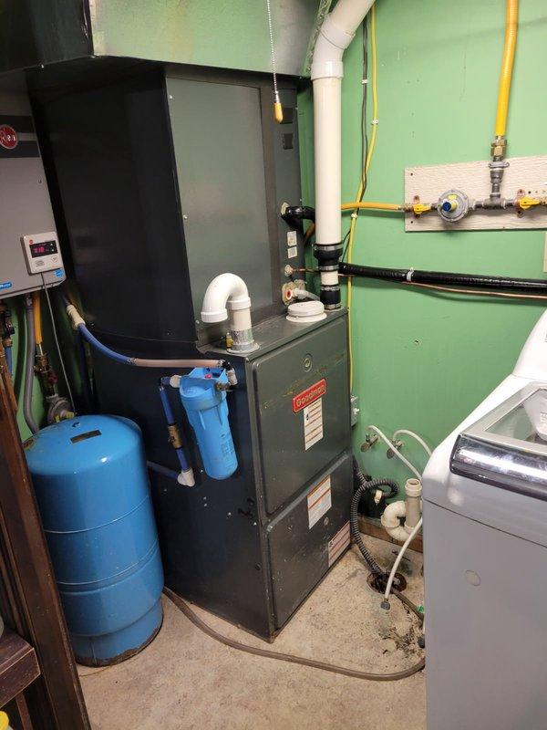 Responded to no-cool call on 10-month-old AC system. Homeowner reported unit running but no airflow from registers and had shut system down earlier in day after changing air filter that morning. Upon arrival, activated system and observed all components operating properly with furnace blower running and achieving 22° temperature split across evaporator coil. Inspected air filter and identified complete saturation with white mineral dust despite clean appearance. Determined contamination source as ultrasonic humidifier producing airborne mineral deposits that clogged filter media and restricted airflow. Educated homeowner on ultrasonic humidifier operation and mineral dust formation process. Homeowner agreed to discontinue humidifier use. Verified system continued cooling properly with adequate airflow. Deactivated humidifier and confirmed AC operating within normal parameters before departure.