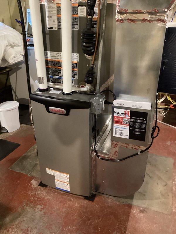 Responded to no cooling complaint on recently installed heat pump system that was blowing warm air. Upon inspection, found system operating in cooling mode but discovered missing "O" wire connection between thermostat hub and furnace control board, preventing reversing valve from switching to cooling operation. Installed proper "O" wire connection to restore communication between thermostat and heat pump controls, verified reversing valve energization, and confirmed system now cooling properly.