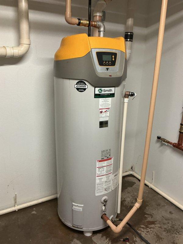 Responded to water leak reported between dual water heater installation and adjacent laundry room. Upon investigation, identified compromised hot water supply line within wall cavity that had also caused catastrophic failure of one water heater tank. Executed repairs to damaged hot water piping and isolated the ruptured water heater unit to prevent further water damage and restore system functionality to the remaining operational heater.