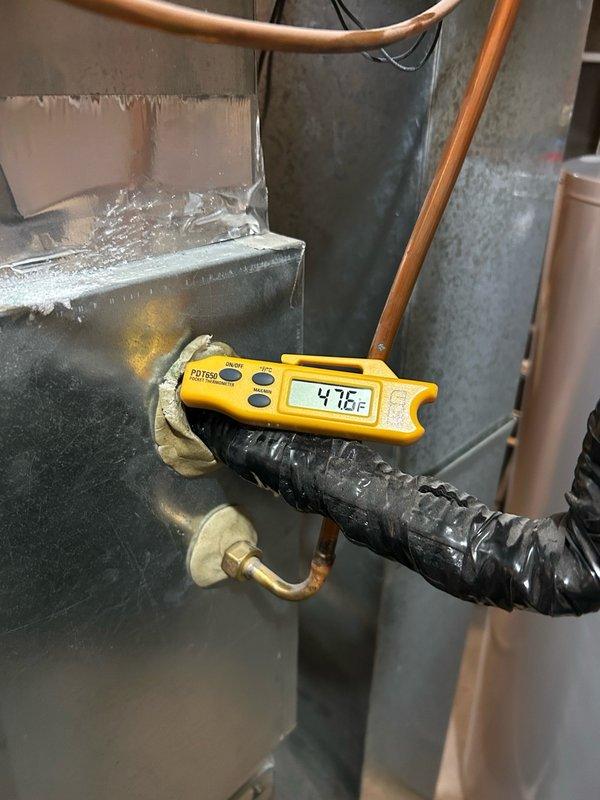 Performed comprehensive AC tune-up inspection on residential cooling system. System found operating properly with all components within normal parameters including thermostat operation, air filter, blower assembly, electrical connections, contactor, capacitor, condensate drain, refrigerant performance, and temperature split showing 42°F on suction line. Condenser coil noted as extremely dirty but system maintained proper cooling operation. Completed preventative maintenance procedures and verified normal system performance. Recommended continued seasonal maintenance to ensure efficient operation and monitor equipment wear.