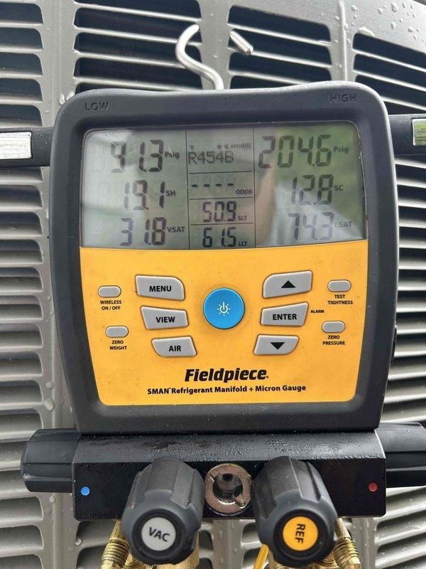 Responded to urgent no-cool call on recently installed EL18BCV unit displaying 411 error code for low pressure switch lockout. Upon arrival, found furnace filter completely plugged, causing severe airflow restriction and triggering system fault. Removed heavily soiled filter, installed new filter, and verified proper airflow at 1200 CFM for 3-ton system capacity.

Connected refrigerant gauges and performed system diagnostics on R454B charge. Found unit running with elevated subcooling values, indicating overcharged condition. Carefully recovered excess refrigerant and precisely dialed in manufacturer-specified subcooling and approach temperatures per EL18 unit charging specifications, as these units require exact charge for proper operation. Verified system performance with 17-degree temperature split across evaporator coil, confirming adequate cooling capacity and proper refrigerant charge. System returned to normal operation with all fault codes cleared. Work completed under warranty