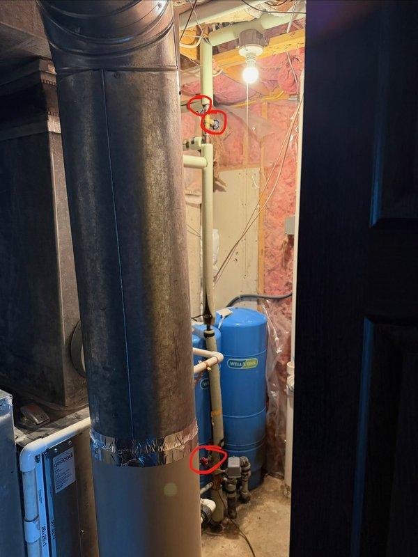 Replaced worn twist-style gate valves with lever-style ball valves on the main water line in the mechanical room near the well pressure tanks. Additionally replaced deteriorated tee fittings adjacent to the pressure tank to ensure proper water flow and system integrity. All connections were tested for leaks and proper operation upon completion.