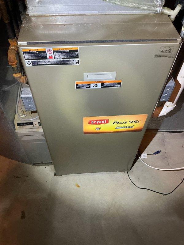 Performed annual air conditioning maintenance tune-up on 15-year-old Bryant system. System was found to be low on refrigerant charge despite having refrigerant and dye added during previous service visit last year. Conducted leak detection inspection and identified active refrigerant leak at the A-Coil, evidenced by UV dye tracing from prior service. Documented system condition with photographs showing furnace unit and coil contamination. Advised customer that A-Coil replacement or full system replacement is required to restore proper operation and prevent continued refrigerant loss.