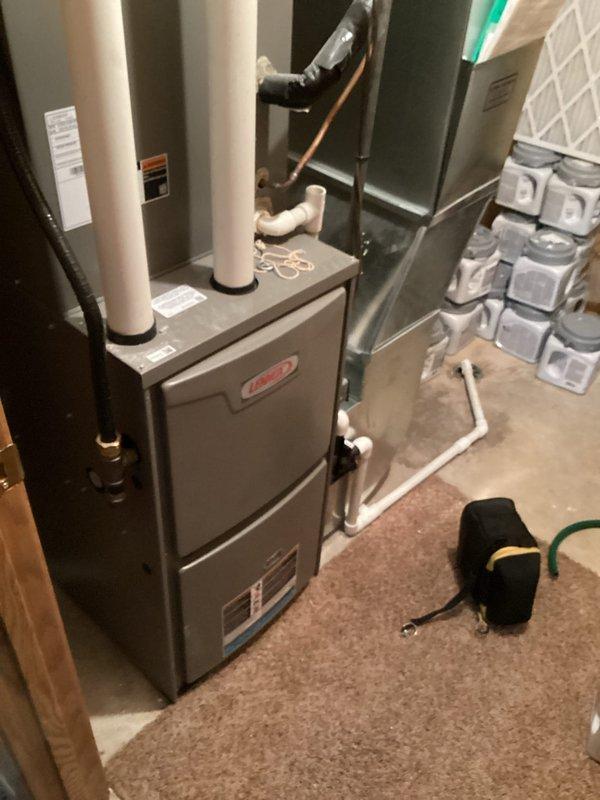 Performed comprehensive preventative maintenance tune-up on a four-year-old Lennox air conditioning system in preparation for the cooling season. Conducted full system inspection including verification of temperature splits, which were found to be within manufacturer specifications. Inspected all electrical connections at the condenser unit, confirming tight connections and proper amp draws within acceptable limits. Removed significant accumulation of cottonwood debris from condenser exterior to ensure proper airflow and heat exchange. Examined capacitor, contactors, and control panel components for signs of wear or deterioration. Verified all refrigerant line connections and insulation integrity between indoor and outdoor units. System operational testing confirmed all components functioning efficiently with no deficiencies noted. Unit is operating properly and ready for summer cooling demands.