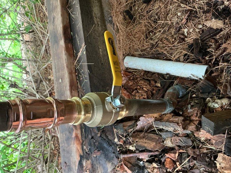 Responded to a water leak on an irrigation system caused by a frozen and broken 1.5-inch brass ball valve. Successfully removed the damaged valve and installed a new 1.5-inch brass ball valve with compression fittings on the copper irrigation line. Unable to pressure test the repair for leaks as the municipal water supply to the system remains shut off by the city.